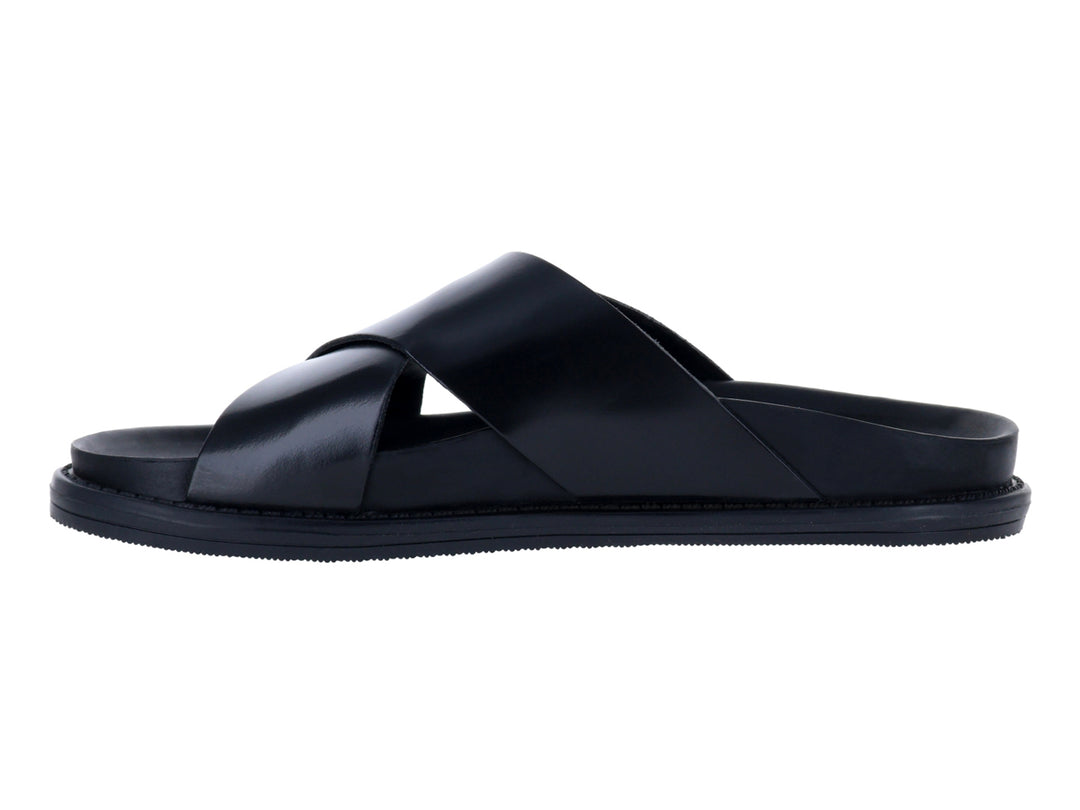 Sandalias negras formales de Steve Madden con tiras cruzadas sobre fondo blanco.