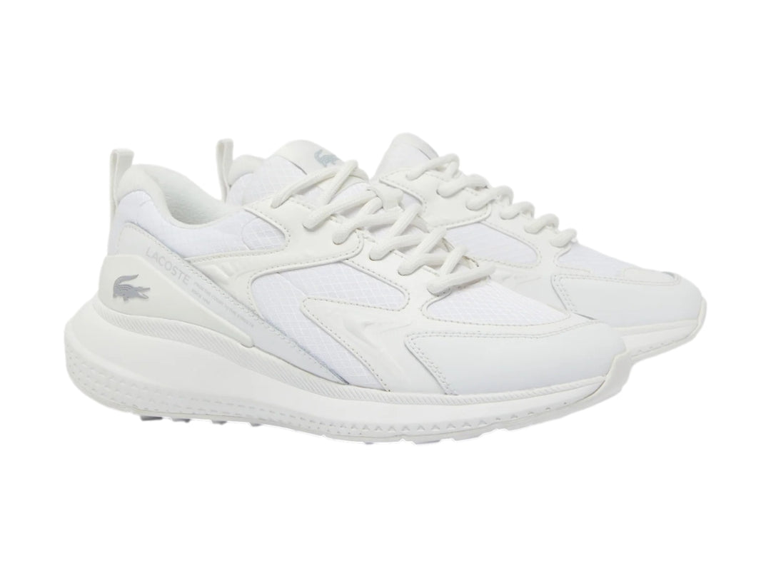 Tenis deportivos Lacoste color blanco con detalles de malla y suela blanca.