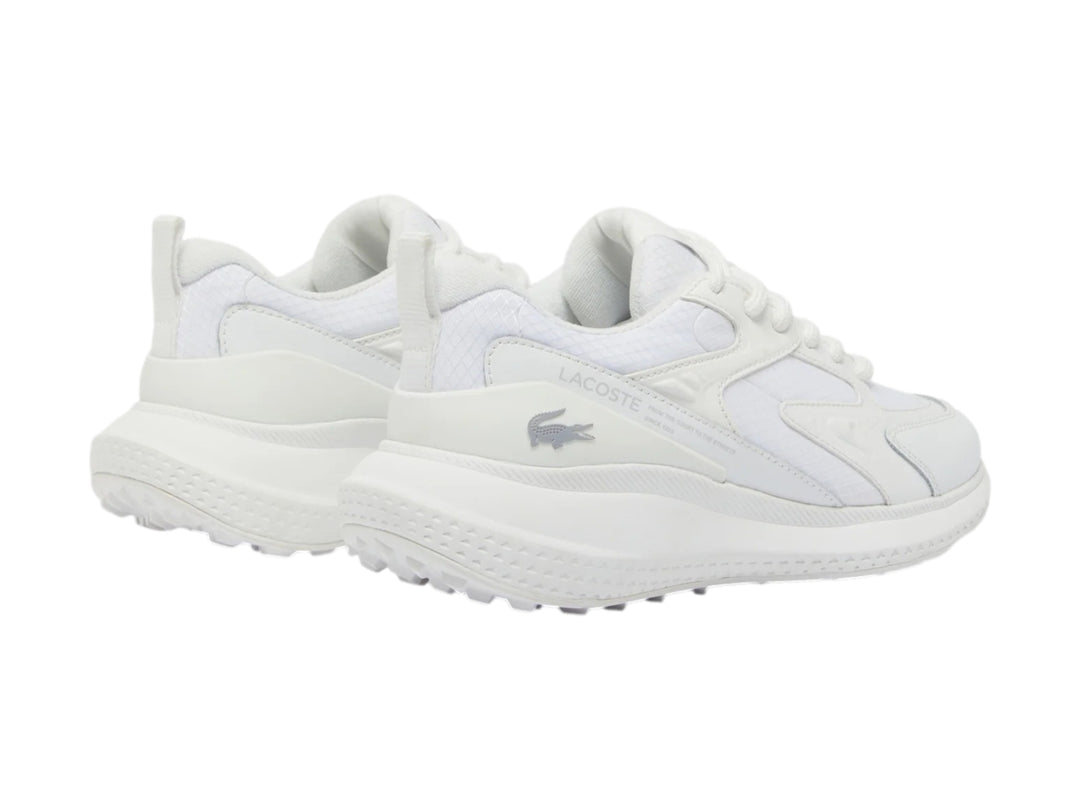 Tenis deportivos Lacoste color blanco con detalles de malla y suela blanca.
