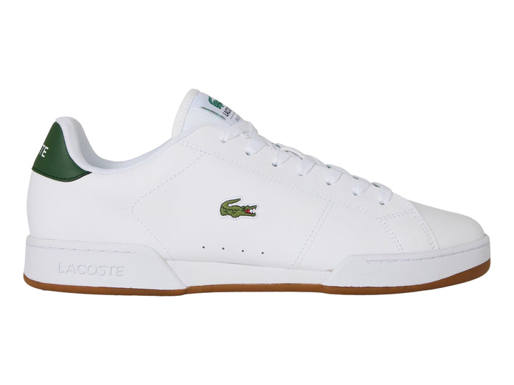 Tenis blancos Lacoste con detalle verde en el talón y suela color café.