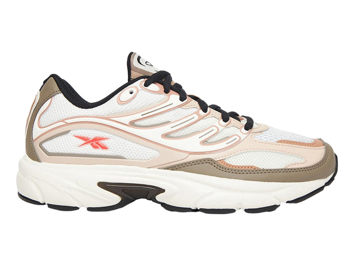 Tenis Reebok Premier Road Control en colores gris, beige y rosa con suela blanca y detalles en negro.