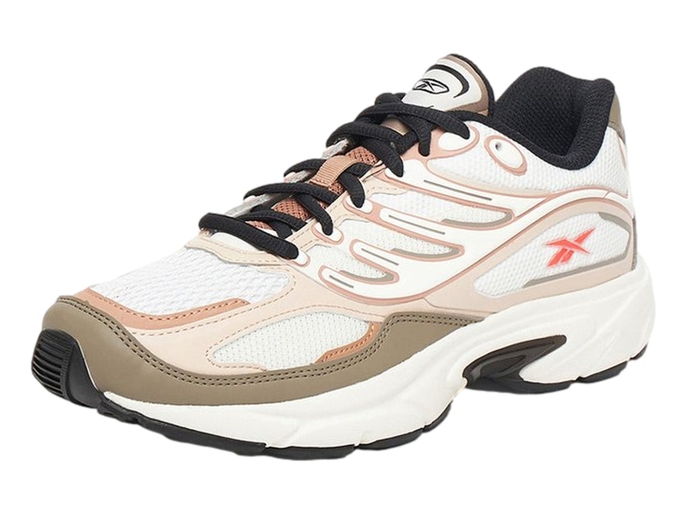 Tenis Reebok Premier Road Control en colores gris, beige y rosa con suela blanca y detalles en negro.