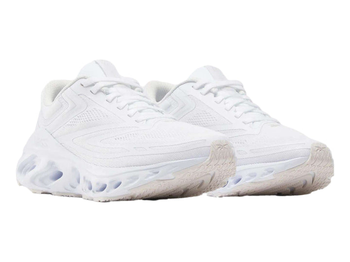 Tenis deportivos Reebok Fuel Flex Run en color blanco con suela geométrica amortiguada.