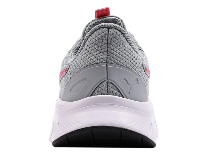 Tenis PUMA color gris con detalles en rosa y suela blanca.