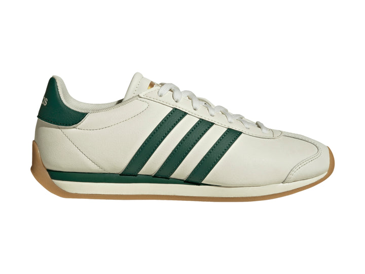 Tenis Adidas Runvista color blanco roto con tres franjas verdes y suela de goma marrón.