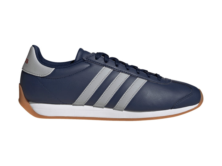 Tenis Adidas Runvista azul marino con franjas grises, entresuela blanca y suela de goma color café.