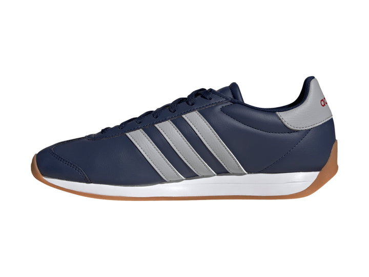 Tenis Adidas Runvista azul marino con franjas grises, entresuela blanca y suela de goma color café.