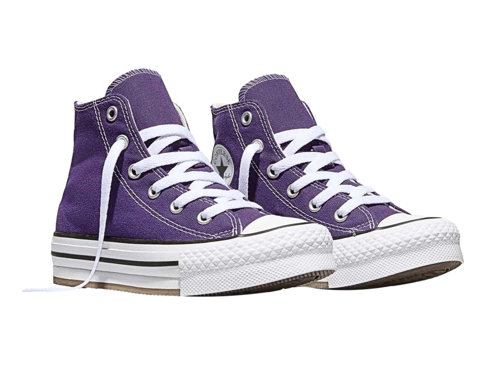 Tenis Converse de bota color morado con suela de plataforma blanca.