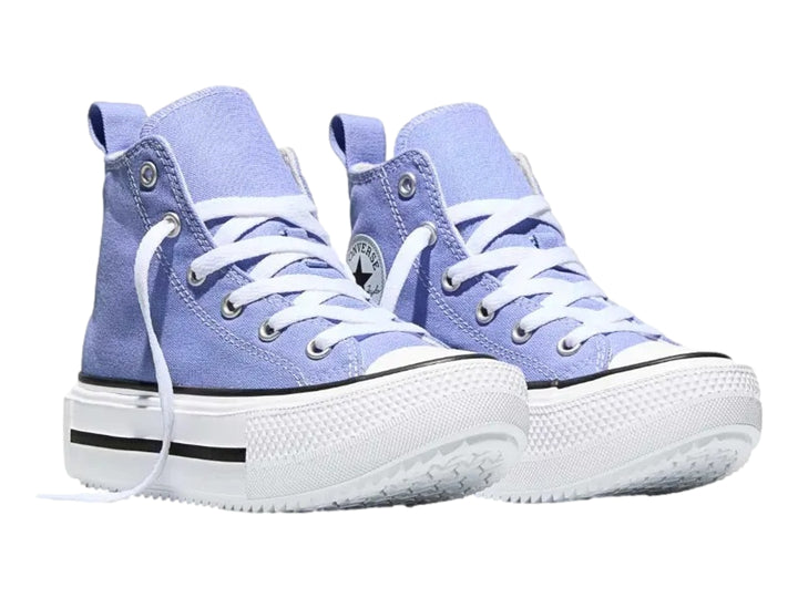 Tenis Converse de bota alta en color lila con suela de plataforma blanca y detalles en negro.