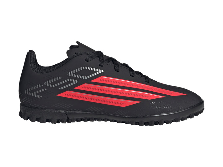 Calzado de fútbol Adidas F50 en color negro con franjas rojas y suela para césped sintético.