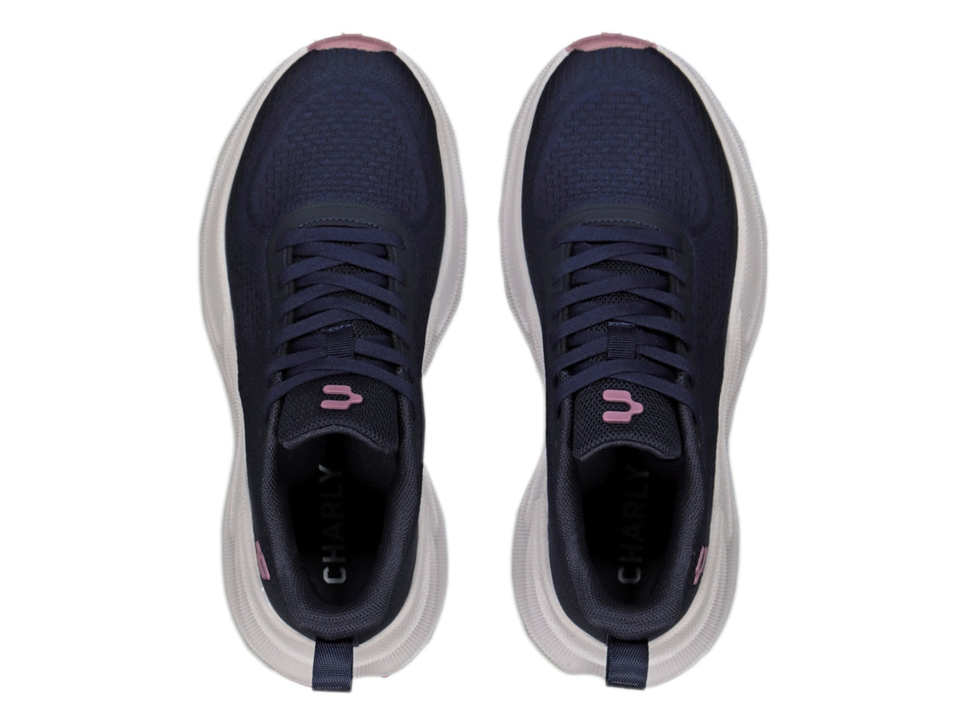 Tenis deportivos Charly color azul marino con suela blanca gruesa y detalles en rosa.