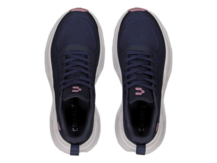 Tenis deportivos Charly color azul marino con suela blanca gruesa y detalles en rosa.