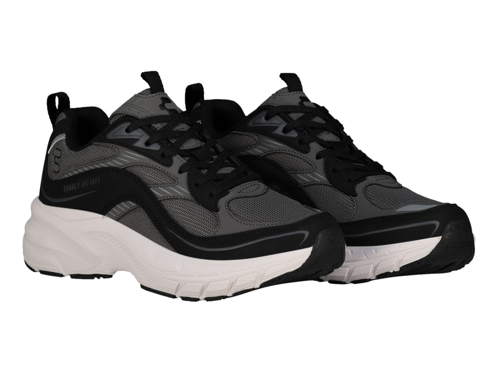 Tenis deportivos Charly color negro con suela blanca ancha y detalles en gris.