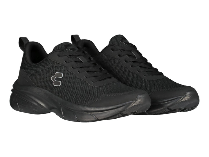 Tenis deportivos Charly de color negro con suela gruesa y logotipo blanco en el lateral.