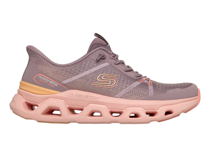 Tenis deportivos Skechers para mujer en color morado con suela gruesa color rosa.