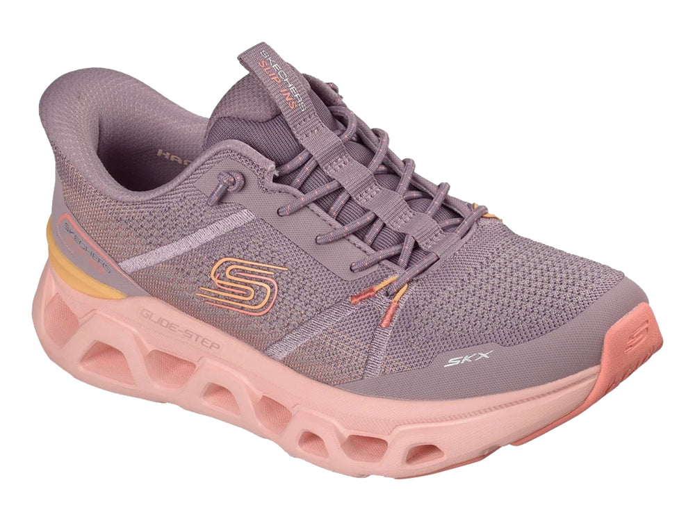 Tenis deportivos Skechers para mujer en color morado con suela gruesa color rosa.