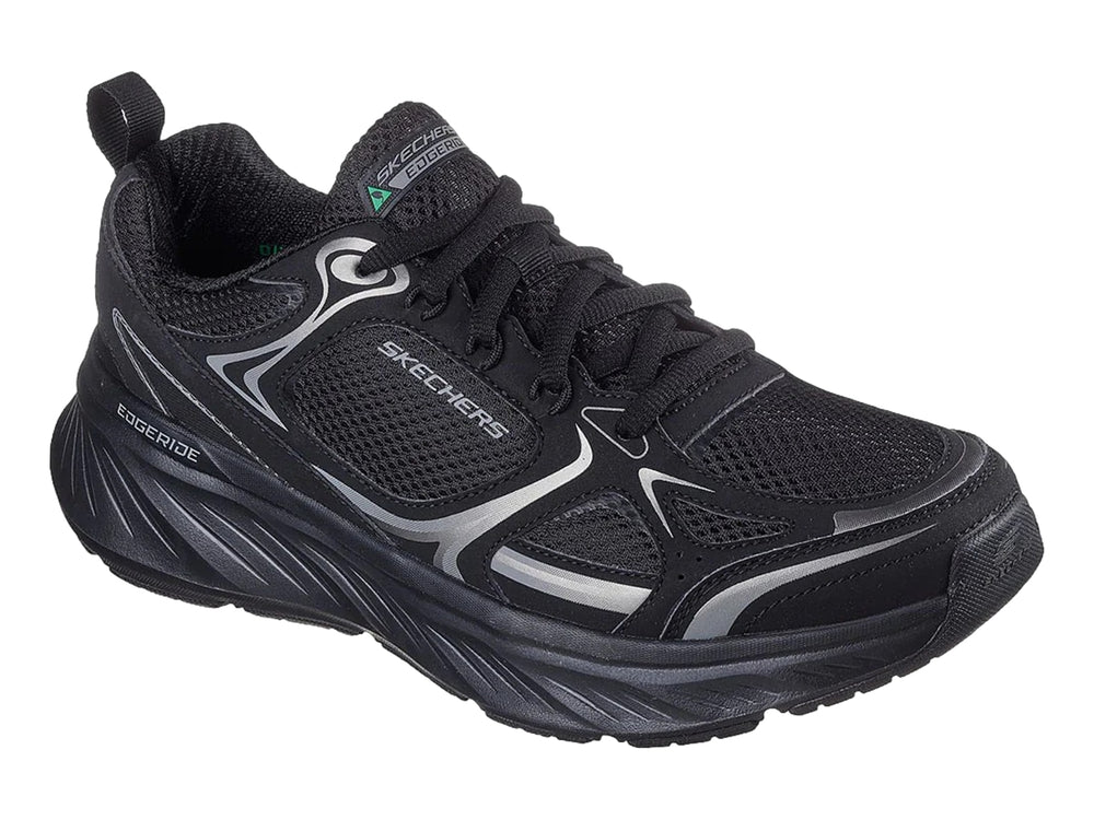 Tenis deportivos Skechers color negro con detalles en plata y suela gruesa.