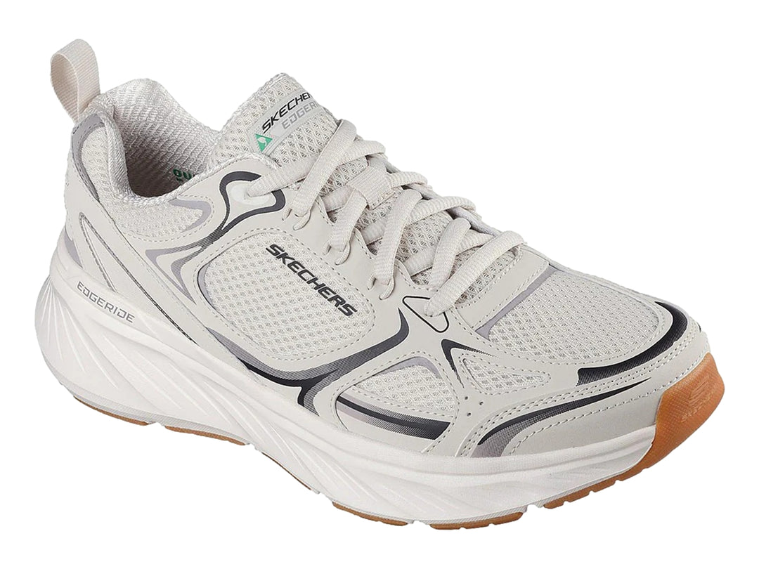 Tenis deportivos Skechers color blanco con detalles en gris y suela color café.