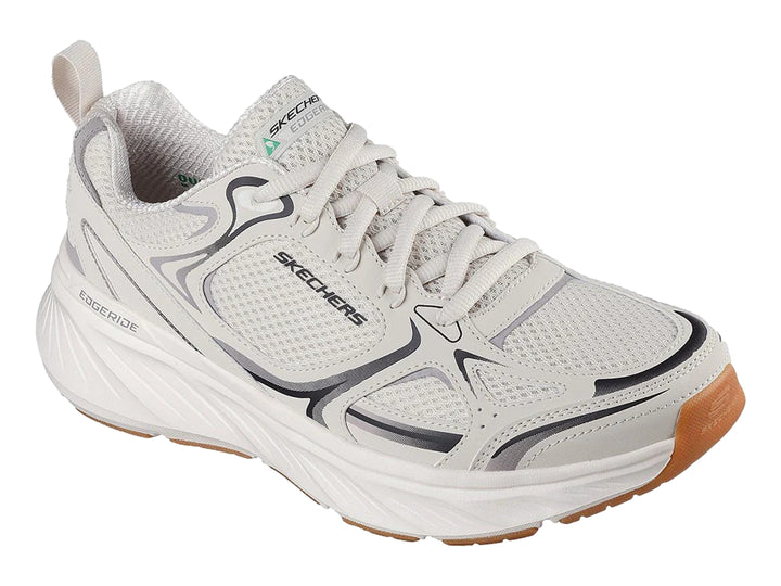 Tenis deportivos Skechers color blanco con detalles en gris y suela color café.