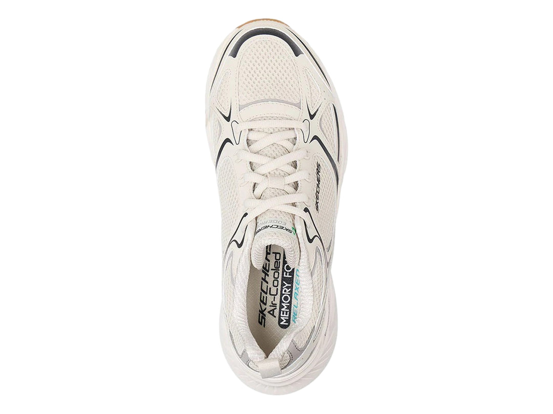 Tenis deportivos Skechers color blanco con detalles en gris y suela color café.