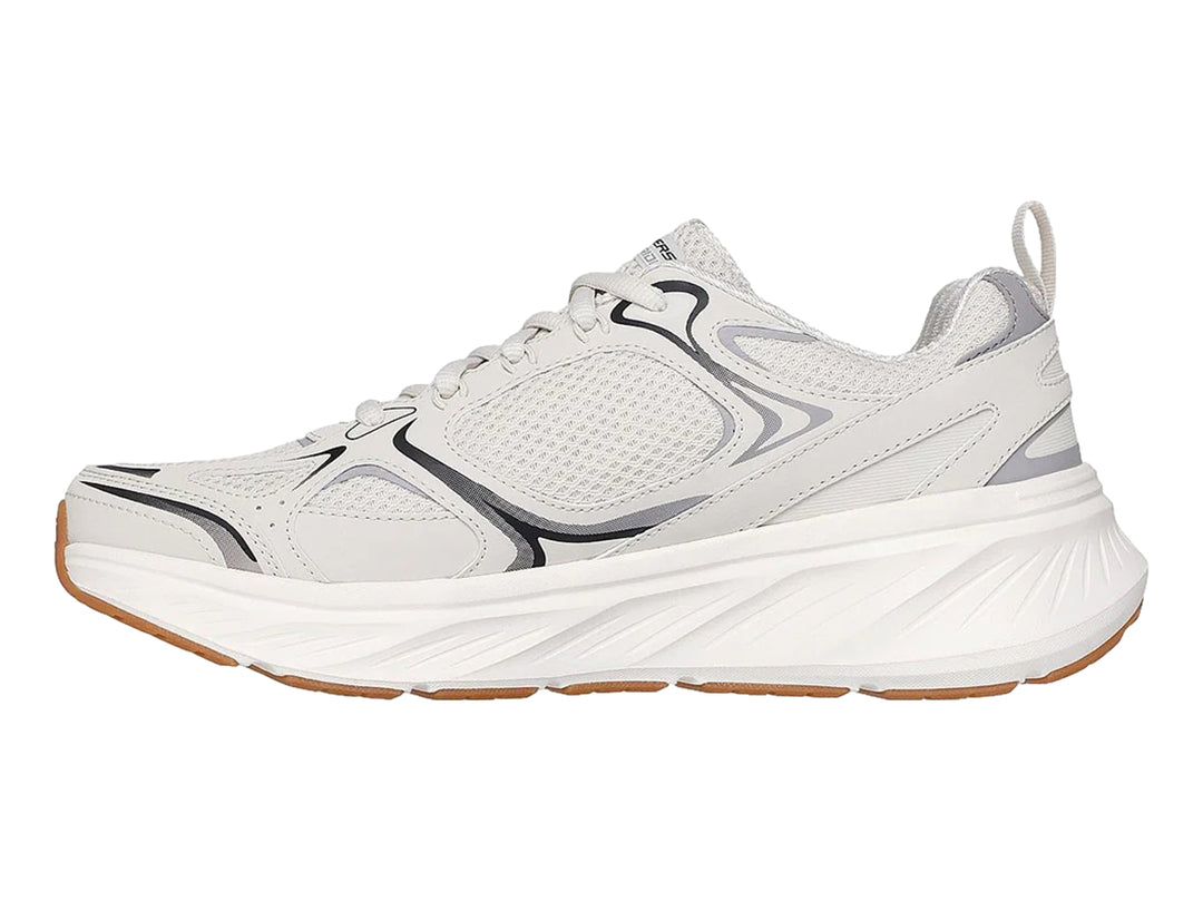 Tenis deportivos Skechers color blanco con detalles en gris y suela color café.