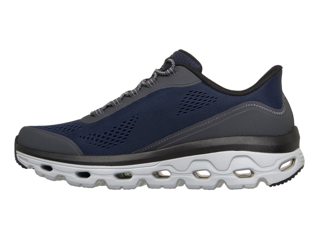 Tenis Skechers color azul marino con detalles en gris y suela blanca Glide-Step para hombre.