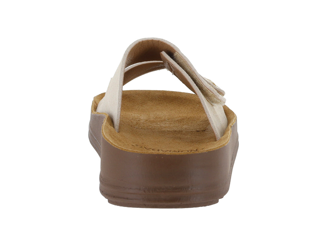 Sandalias Nomadas color beige con suela marrón y dos correas ajustables.