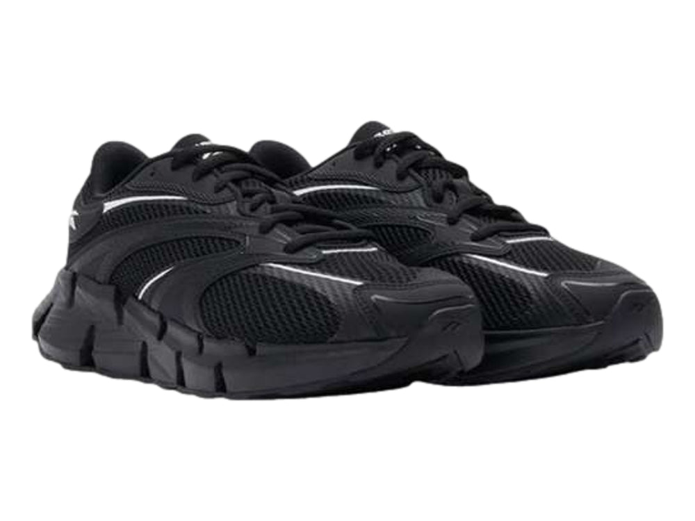 Tenis deportivos Reebok Zig Hypnotica color negro con suela esculpida y detalles en blanco.
