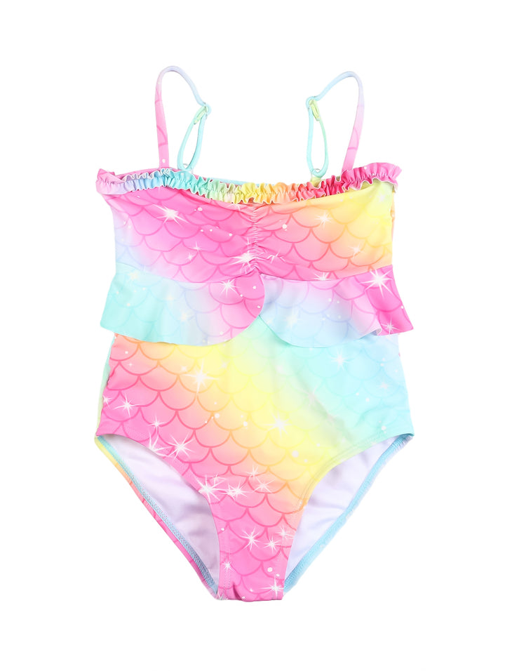 Traje de baño para niña con estampado de escamas de sirena en colores rosa, amarillo y azul con volante frontal.