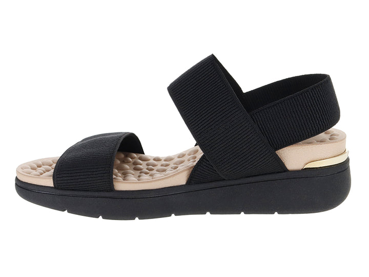 Sandalia de confort color negro con plantilla beige y tiras anchas elásticas.