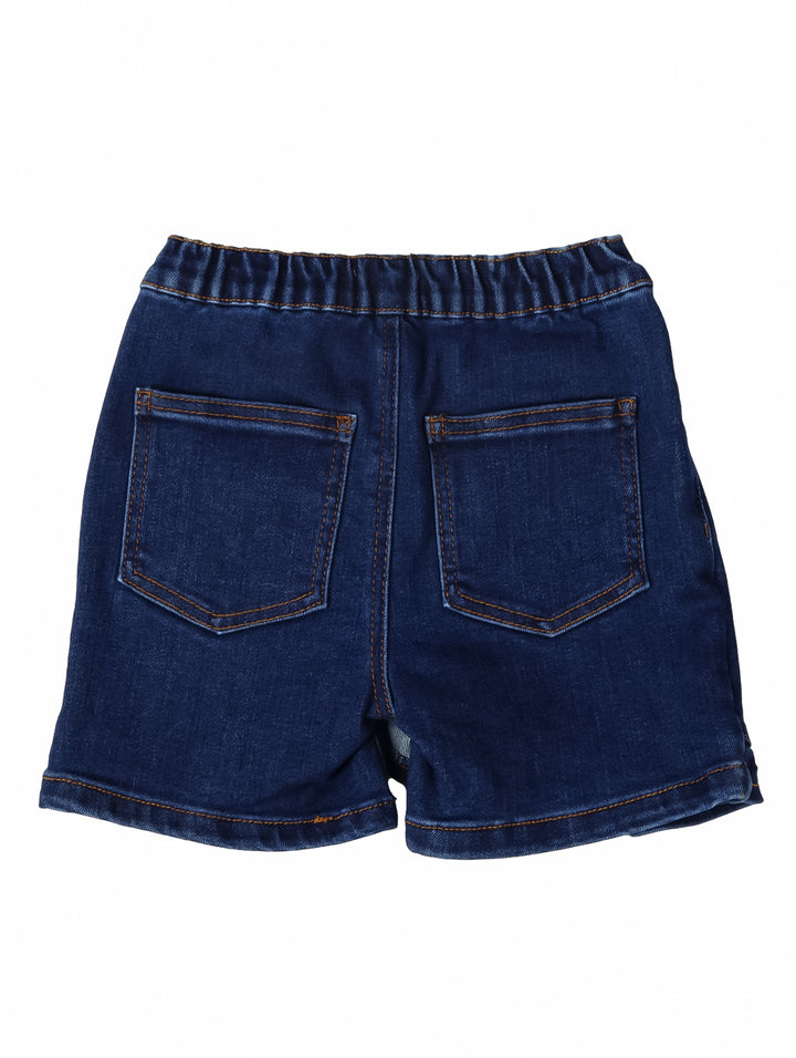 Short falda de mezclilla color azul oscuro para niña con cintura elástica y costuras naranjas.