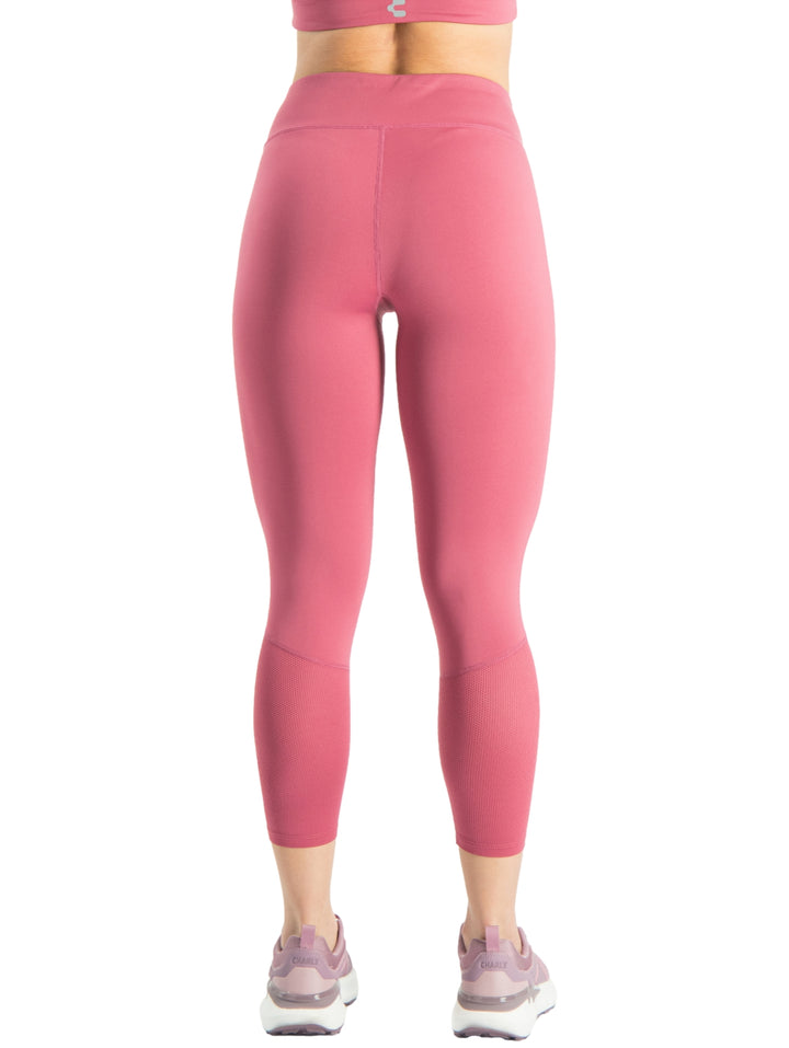 Leggings deportivos ajustados de color rosa para mujer.