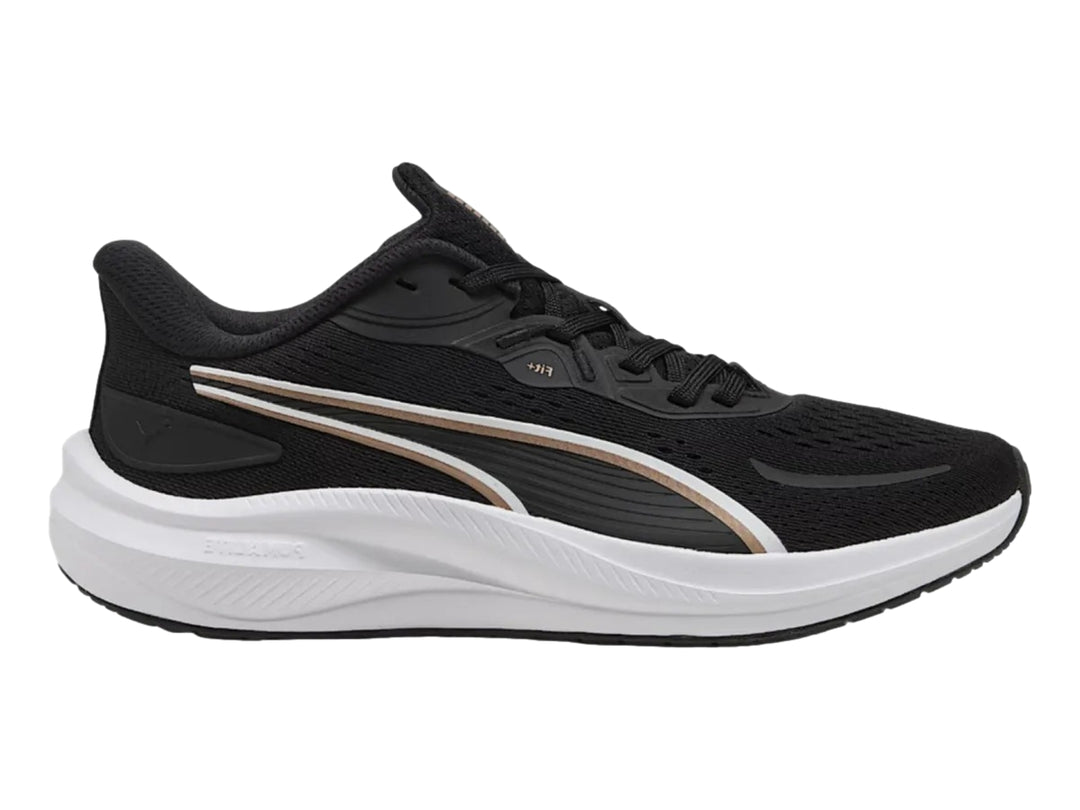 Tenis deportivos PUMA Skyrocket Lite 2 en color negro con detalles dorados y suela blanca para mujer.