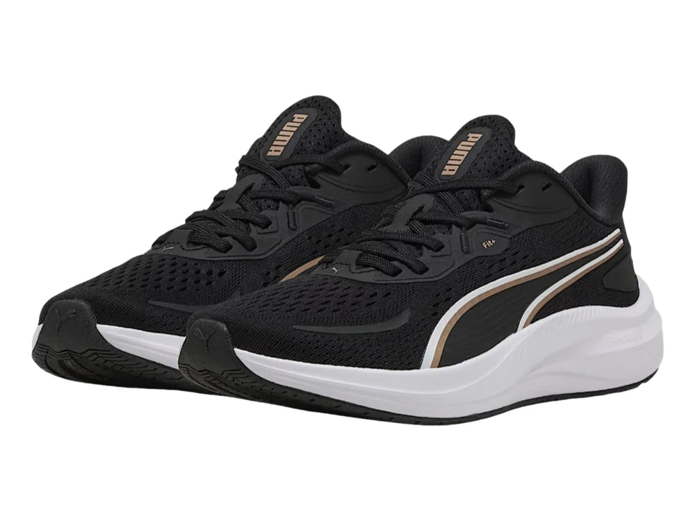 Tenis deportivos PUMA Skyrocket Lite 2 en color negro con detalles dorados y suela blanca para mujer.