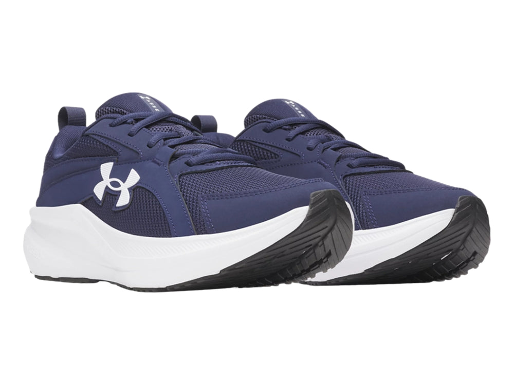 Tenis deportivos Under Armour color azul con suela blanca y logotipo blanco.