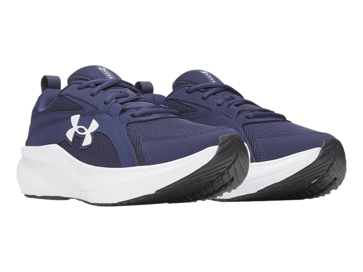 Tenis deportivos Under Armour color azul con suela blanca y logotipo blanco.