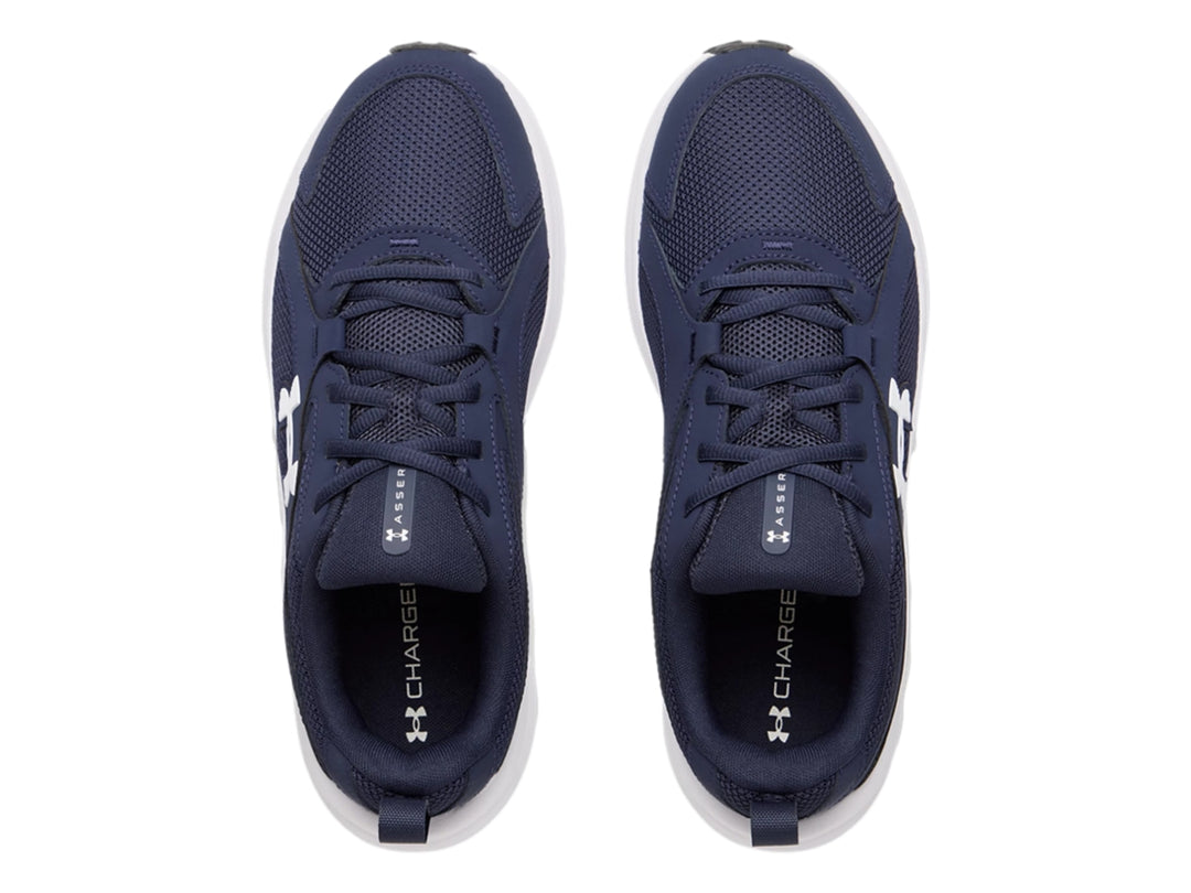 Tenis deportivos Under Armour color azul con suela blanca y logotipo blanco.