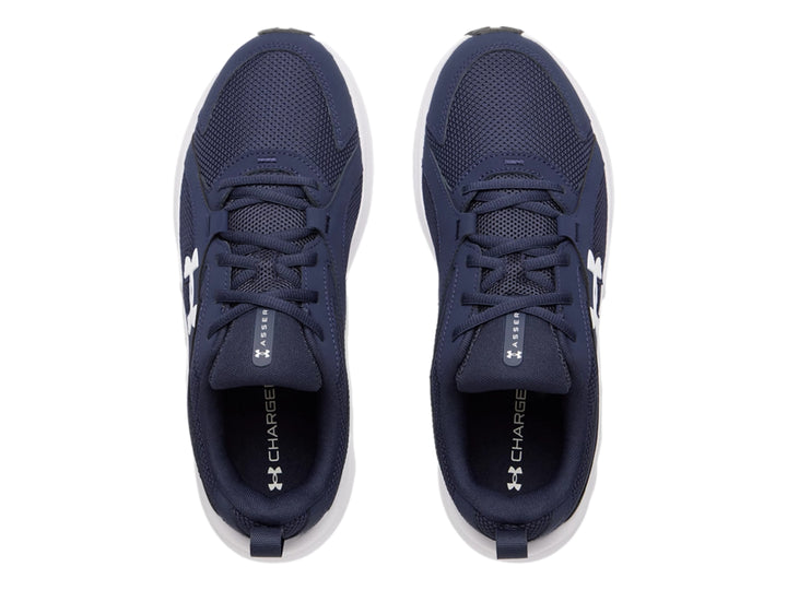 Tenis deportivos Under Armour color azul con suela blanca y logotipo blanco.