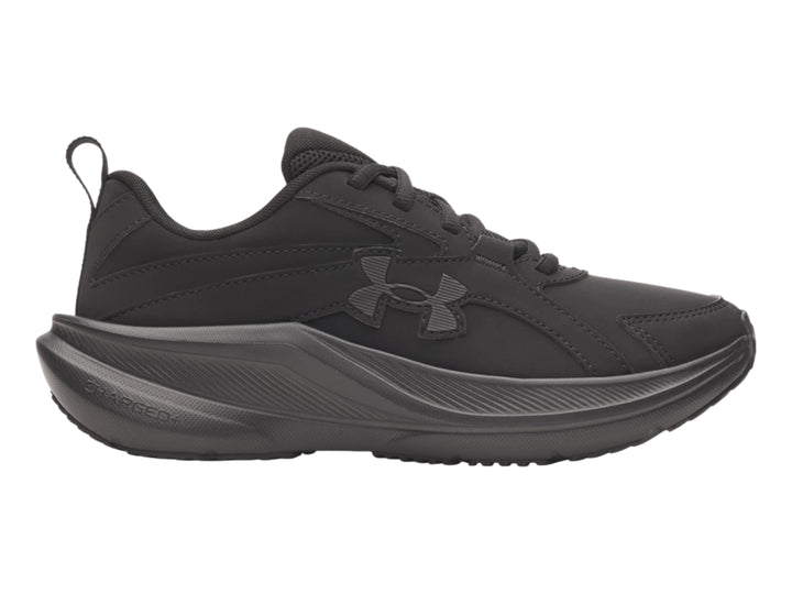 Tenis deportivos Under Armour para niños en color negro sólido con suela gruesa.
