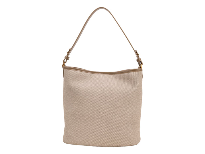 Bolso de hombro Cloe en color beige con textura tejida y asa sencilla.