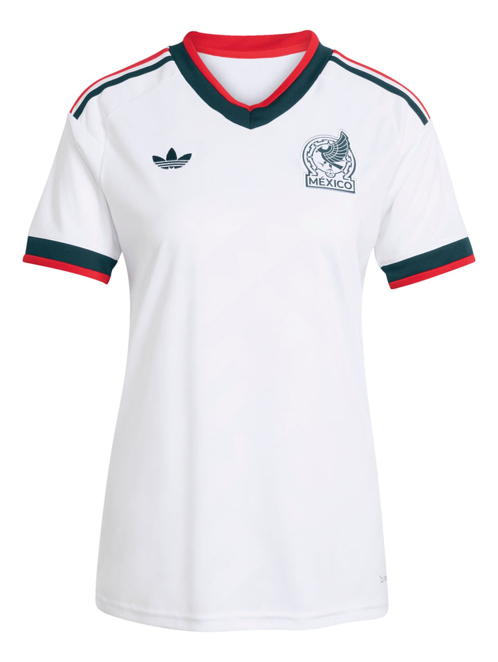 Jersey blanco de la Selección Mexicana de Fútbol con detalles en verde y rojo de la marca Adidas.