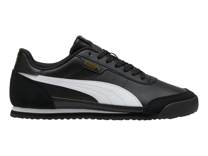 Tenis PUMA Turino II OG color negro con franja blanca lateral y detalles dorados.