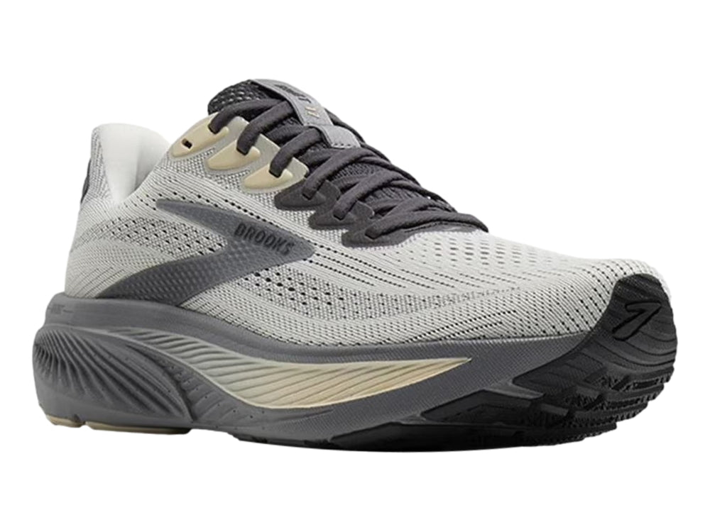 Tenis deportivos Brooks en color gris vaporoso con detalles en beige y suela gris oscuro.