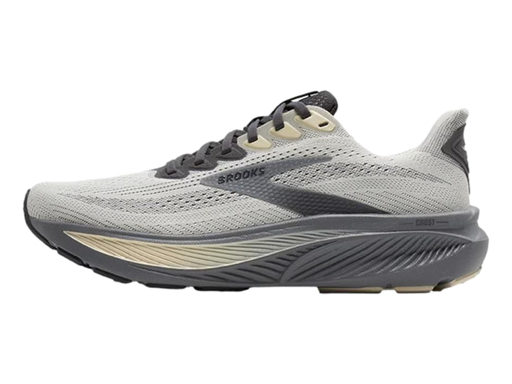 Tenis deportivos Brooks en color gris vaporoso con detalles en beige y suela gris oscuro.