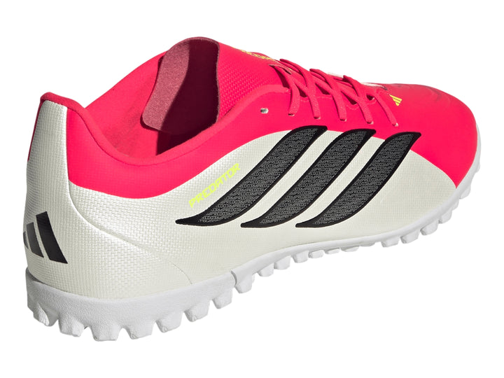 Calzado de fútbol Adidas Predator Club TF en colores rosa y blanco con suela para césped sintético.