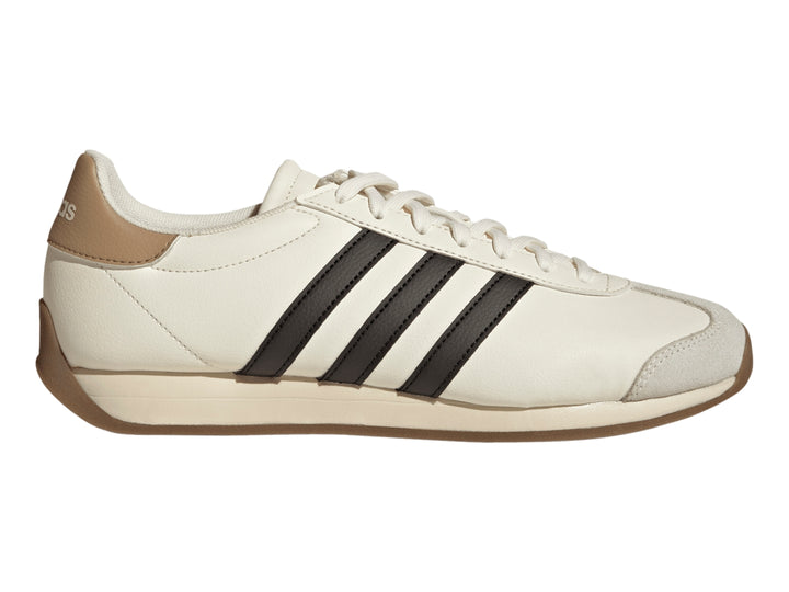 Tenis Adidas color blanco crema con tres franjas negras laterales y suela color café.