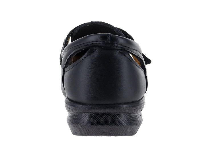 Zapato cerrado color negro para mujer, estilo confort con suela plana y correa ajustable.