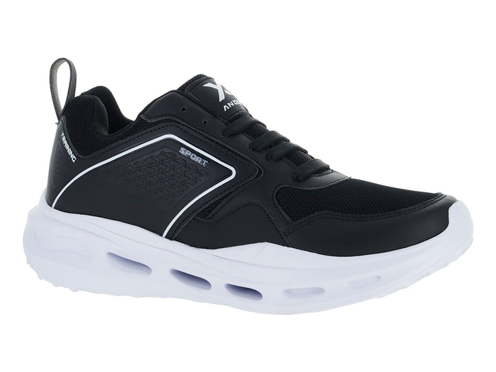 Tenis deportivos Andrax color negro con suela blanca ancha y detalles en textil.