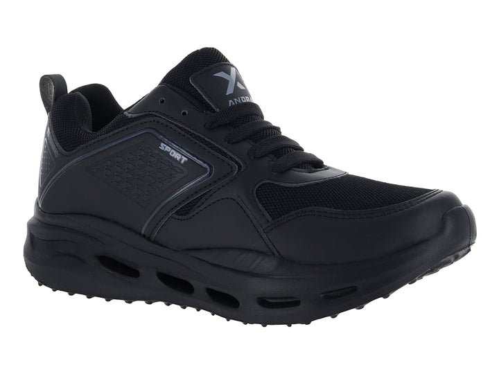 Tenis deportivos Andrax color negro con suela gruesa y detalles en textil.