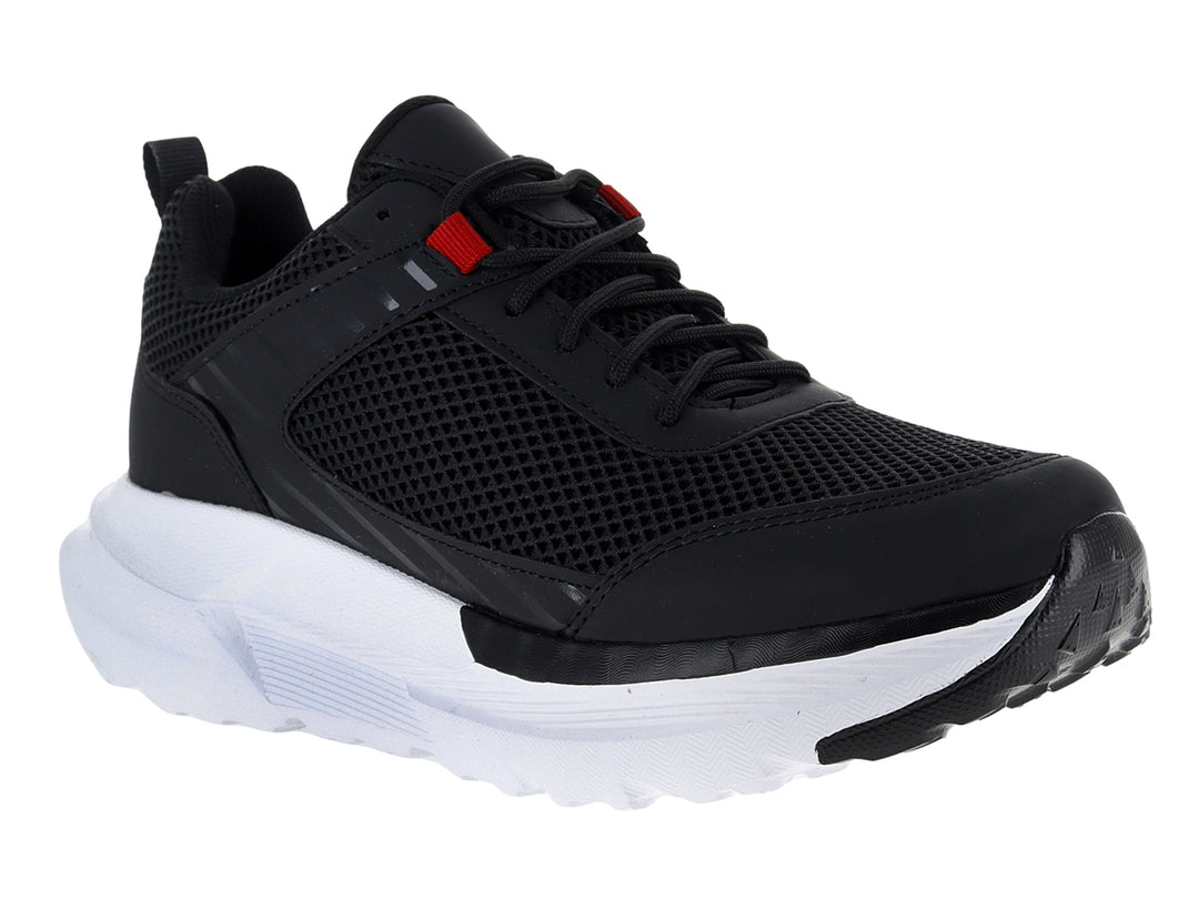 Tenis deportivos Andrax color negro con suela blanca ancha y detalle rojo en la lengüeta.